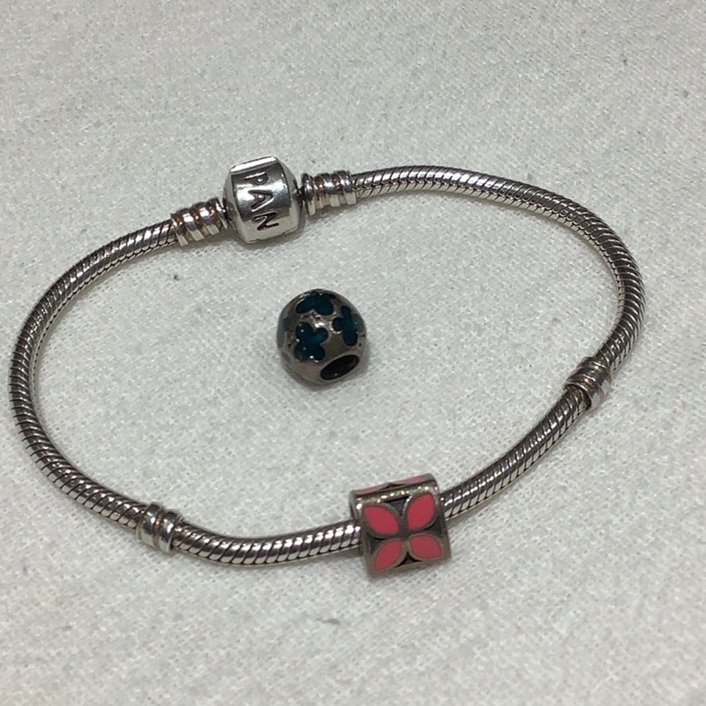 Pandora bracelet and 2 flower charms.